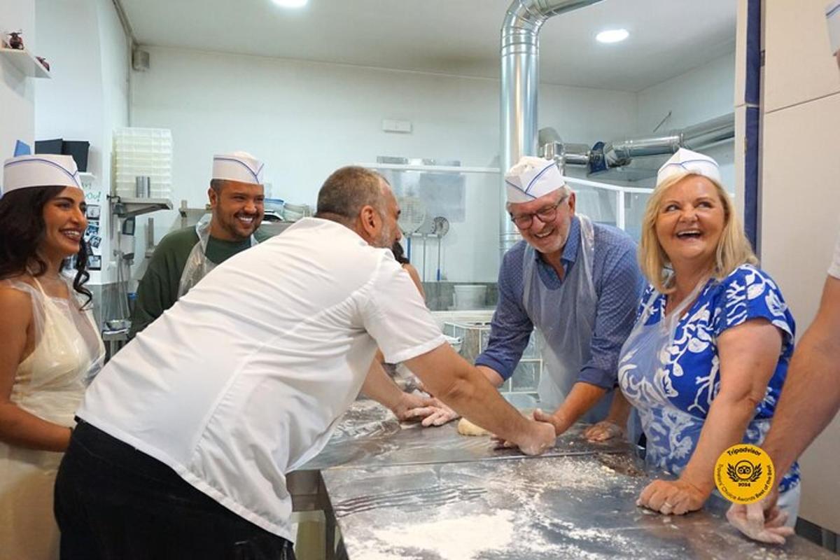 a group of people in a kitchen preparing food