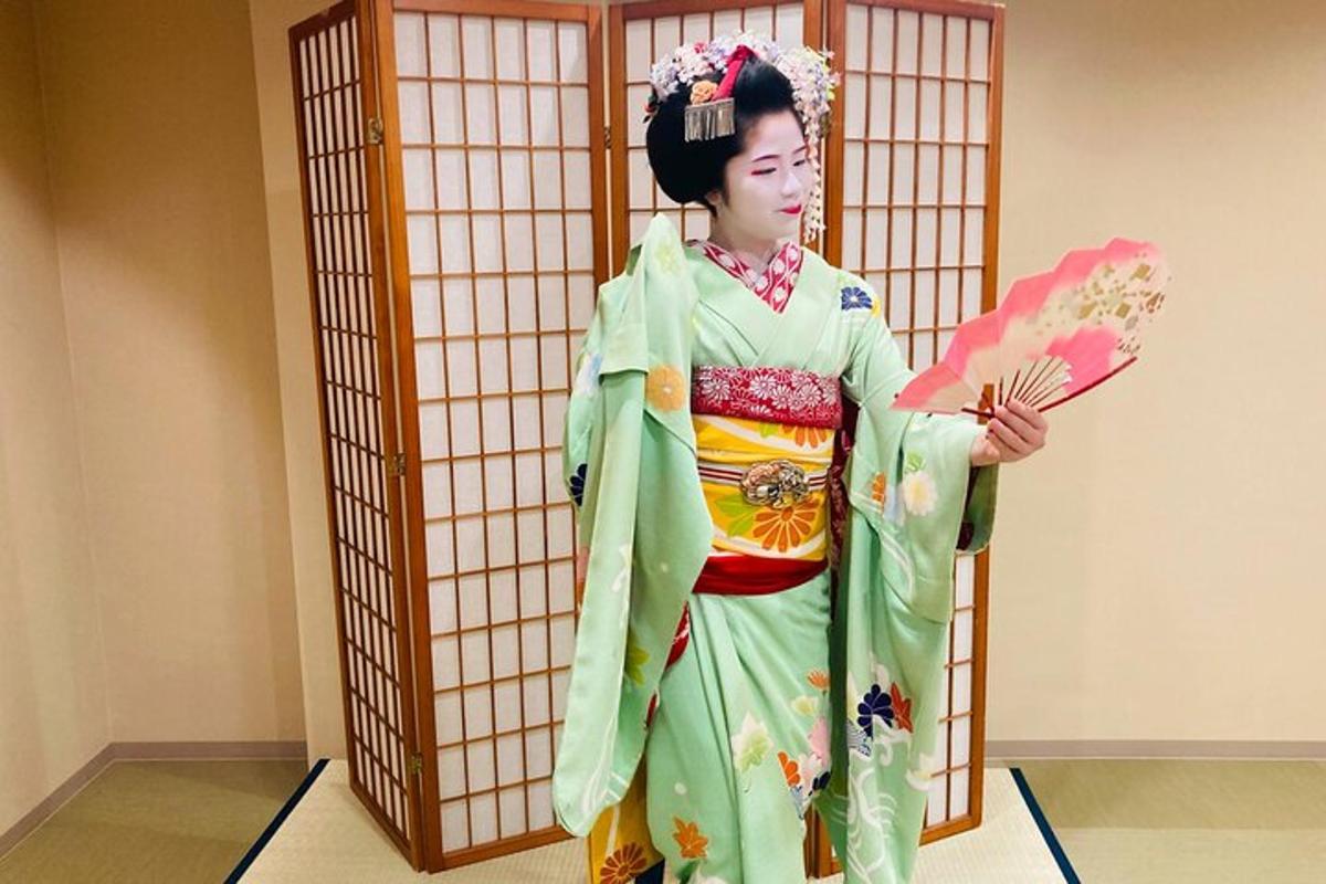 a woman in a kimono holding a parasol