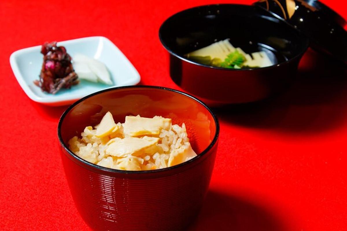 a table with two cups of food and a plate of food