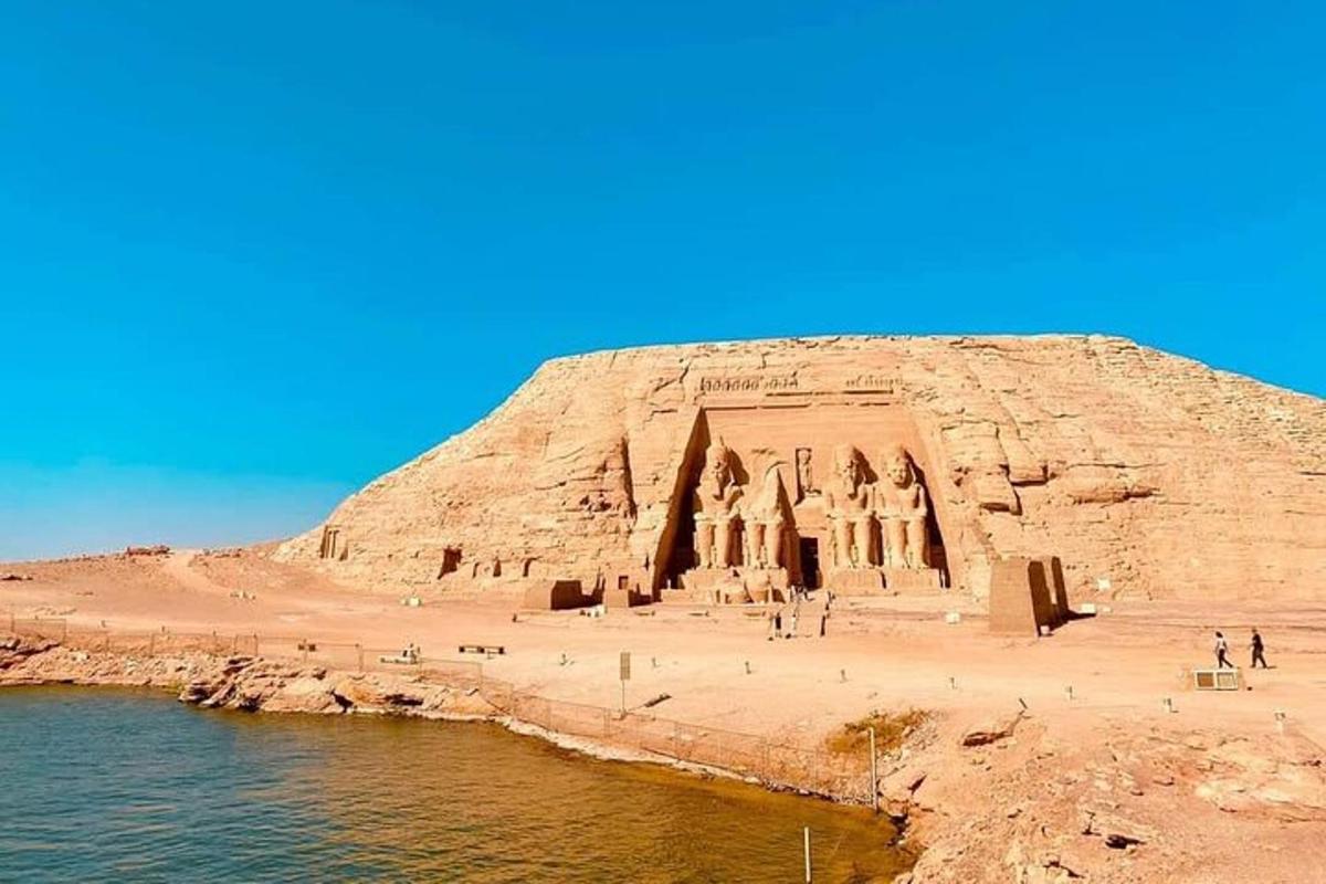 an ancient temple on the side of a rock cliff