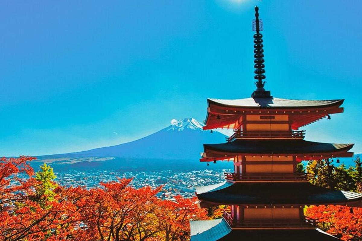 a pagoda with a mountain in the background