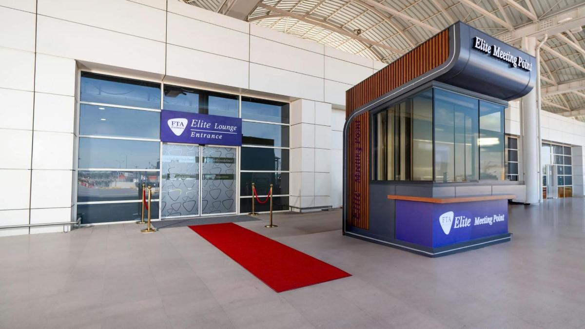 a building with a red carpet in front of a building