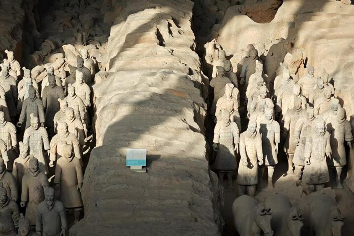 a statue of a group of people on a cliff