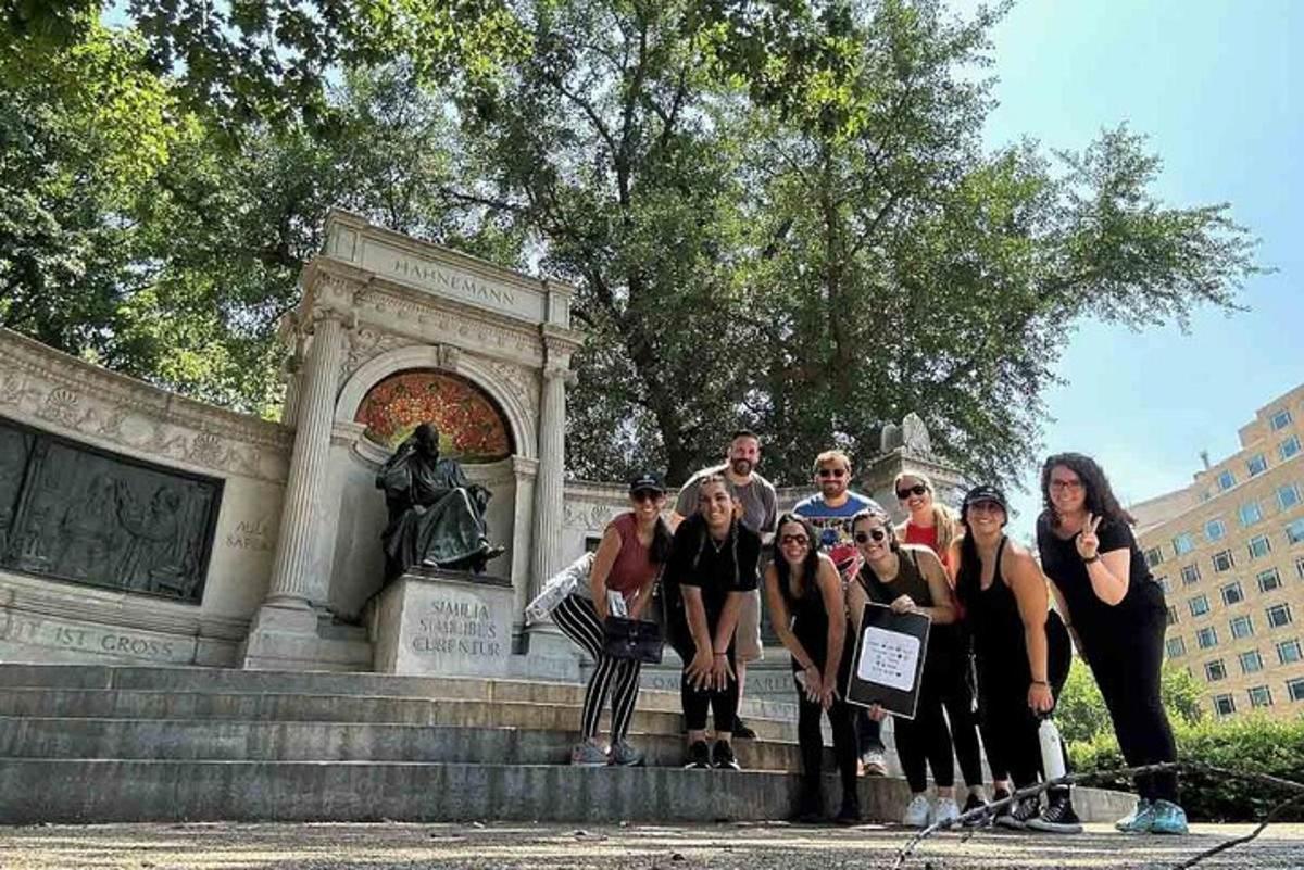 a group of people standing in front of a monument