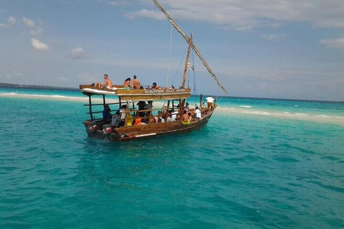 a group of people on a boat in the ocean