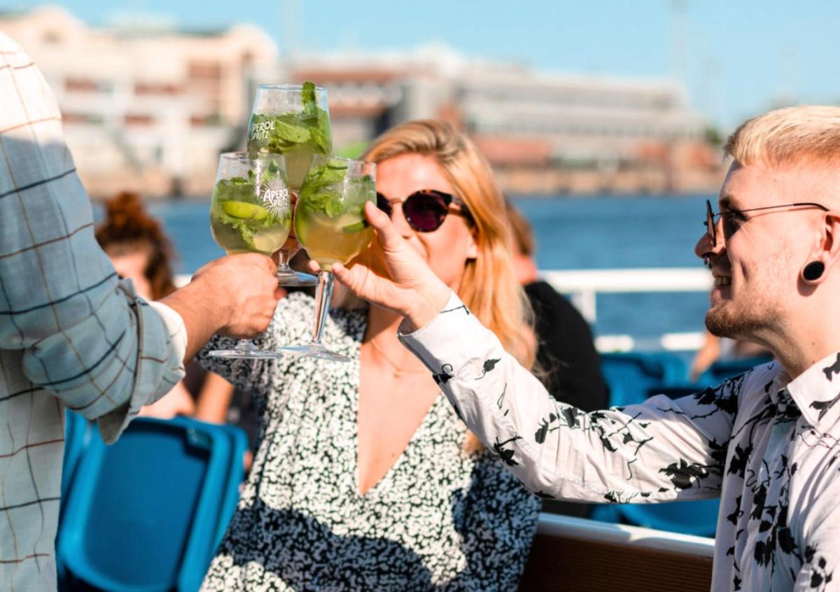 a man and woman holding up glasses of wine