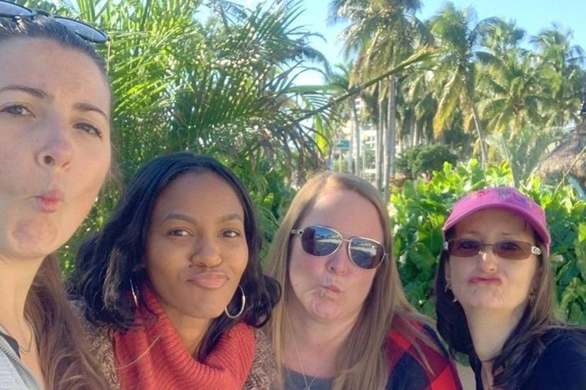 a group of four women posing for a picture
