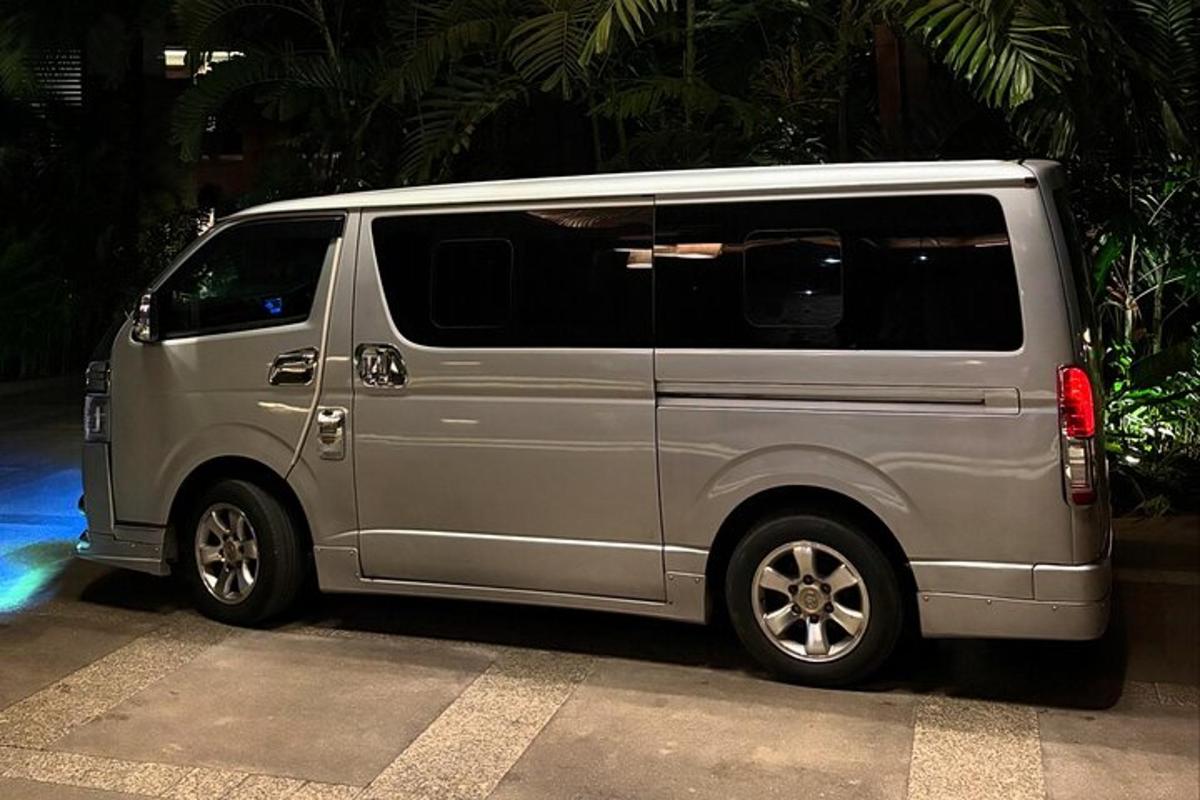 a silver van parked in a parking lot