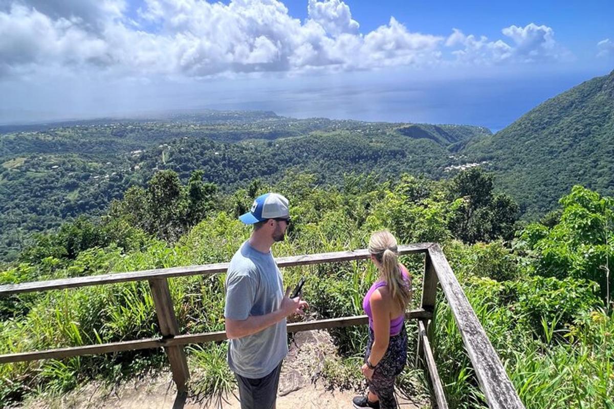 a man and a woman standing on top of a mountain