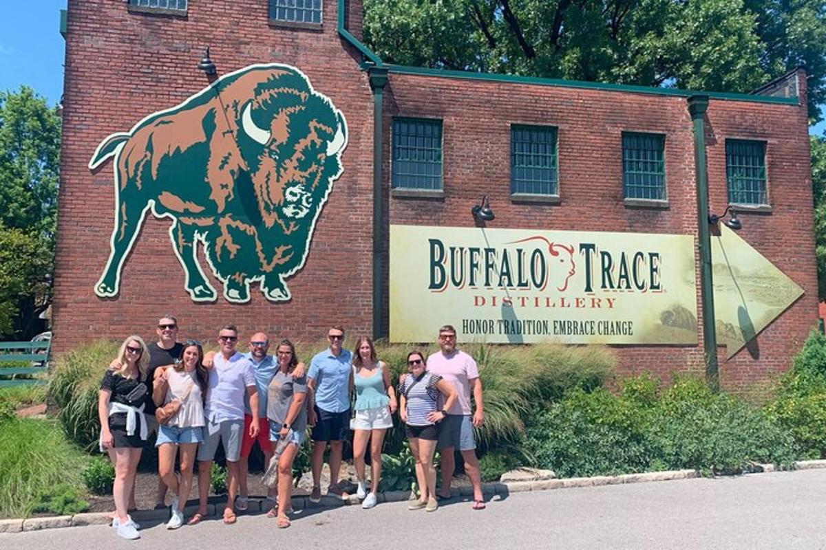 a group of people standing in front of a brick building