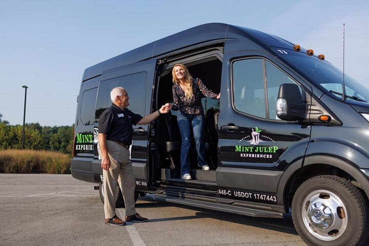 a man and woman standing in the back of a van