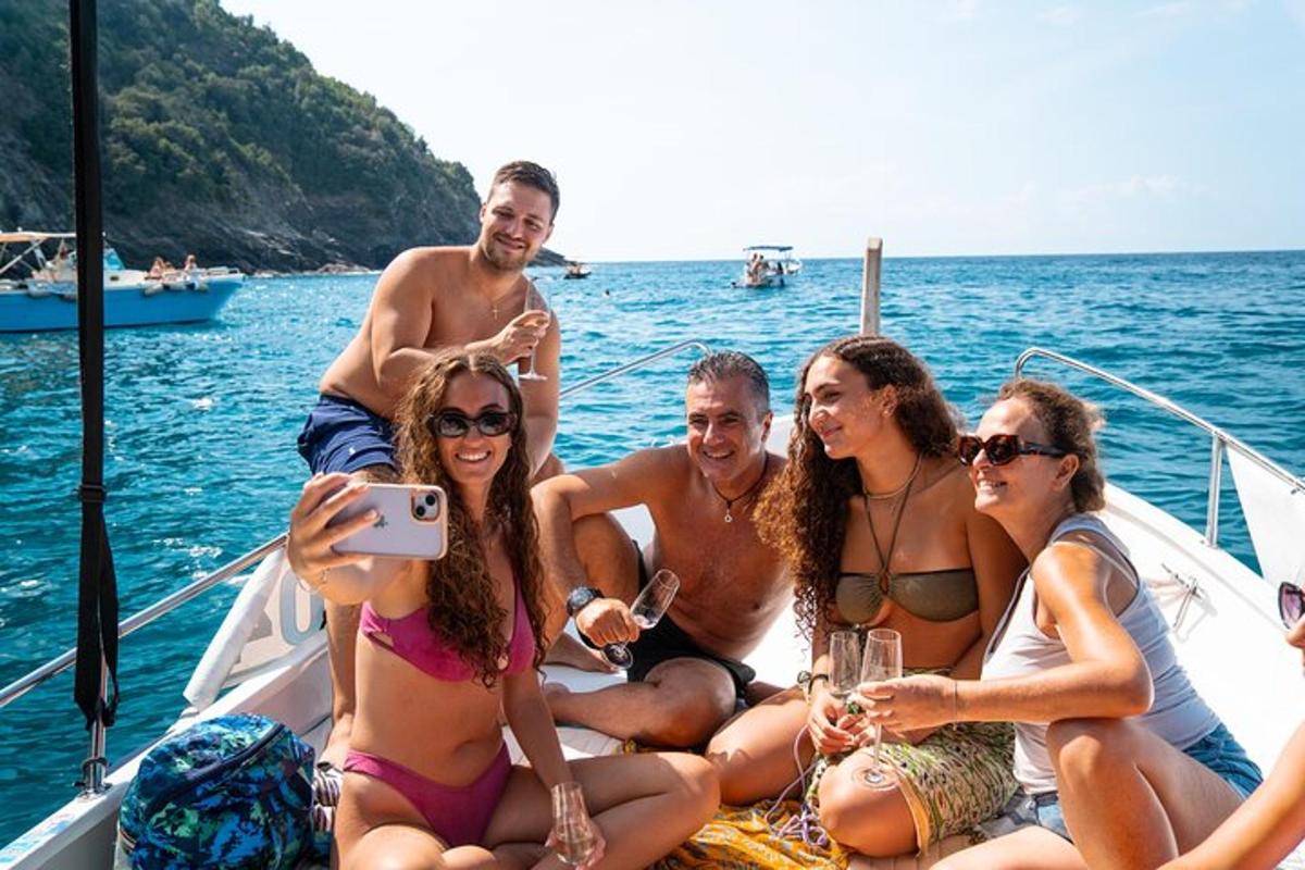 a group of people sitting on a boat in the water