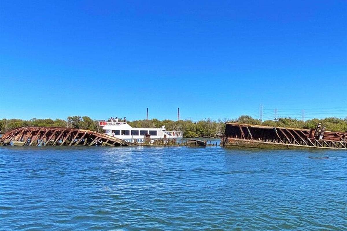 an old rusty bridge in the middle of the water
