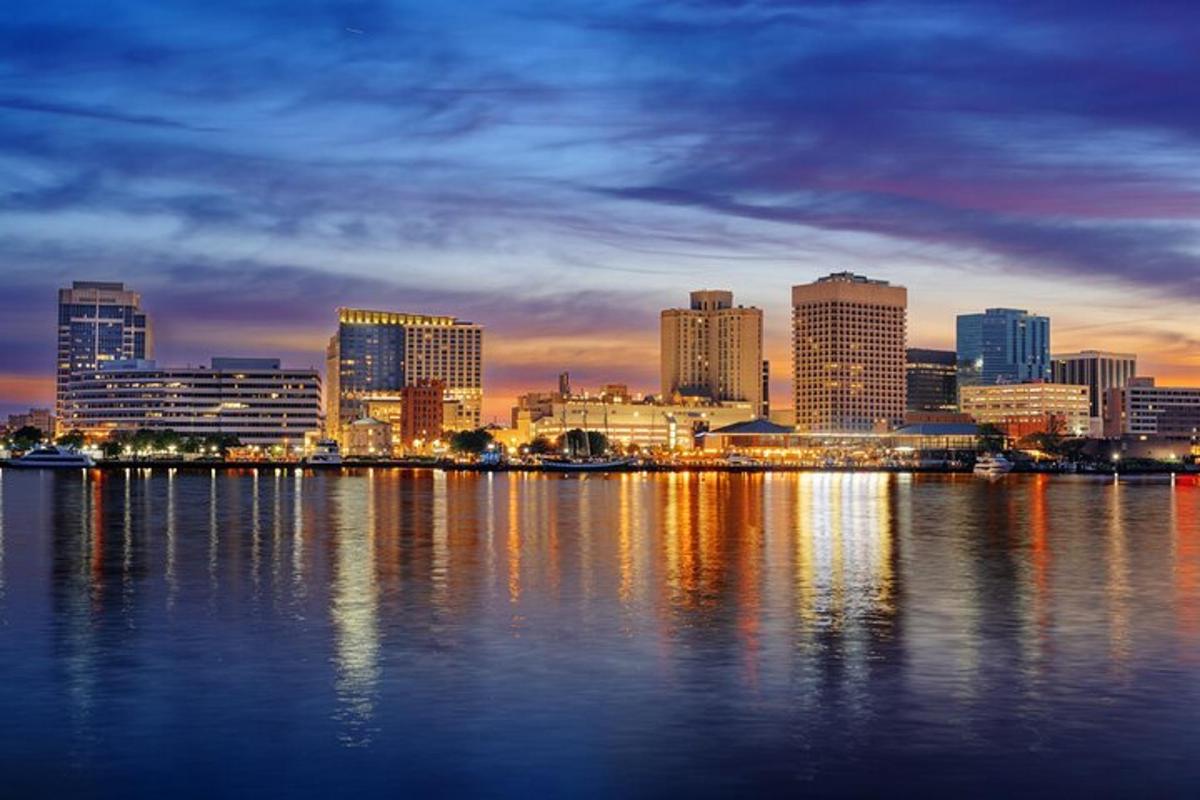 a view of a city skyline at night from the water