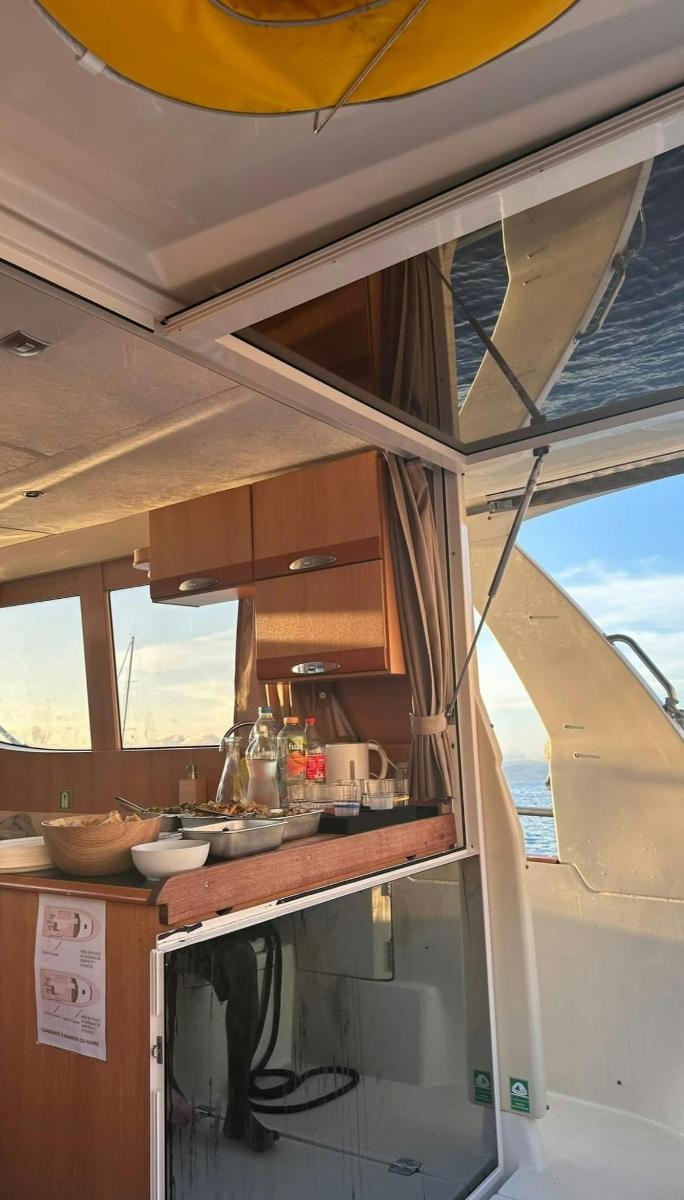 an open kitchen on a boat with a window