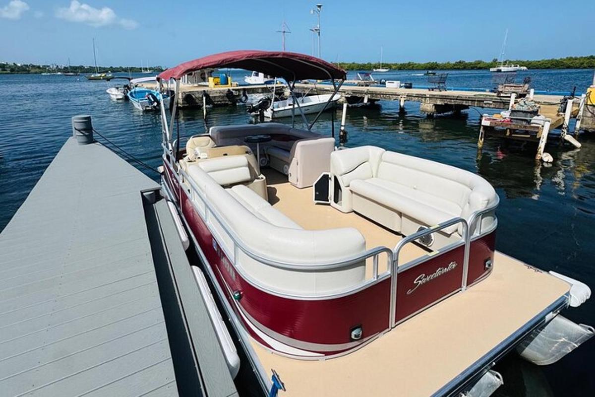 a red and white boat parked at a dock