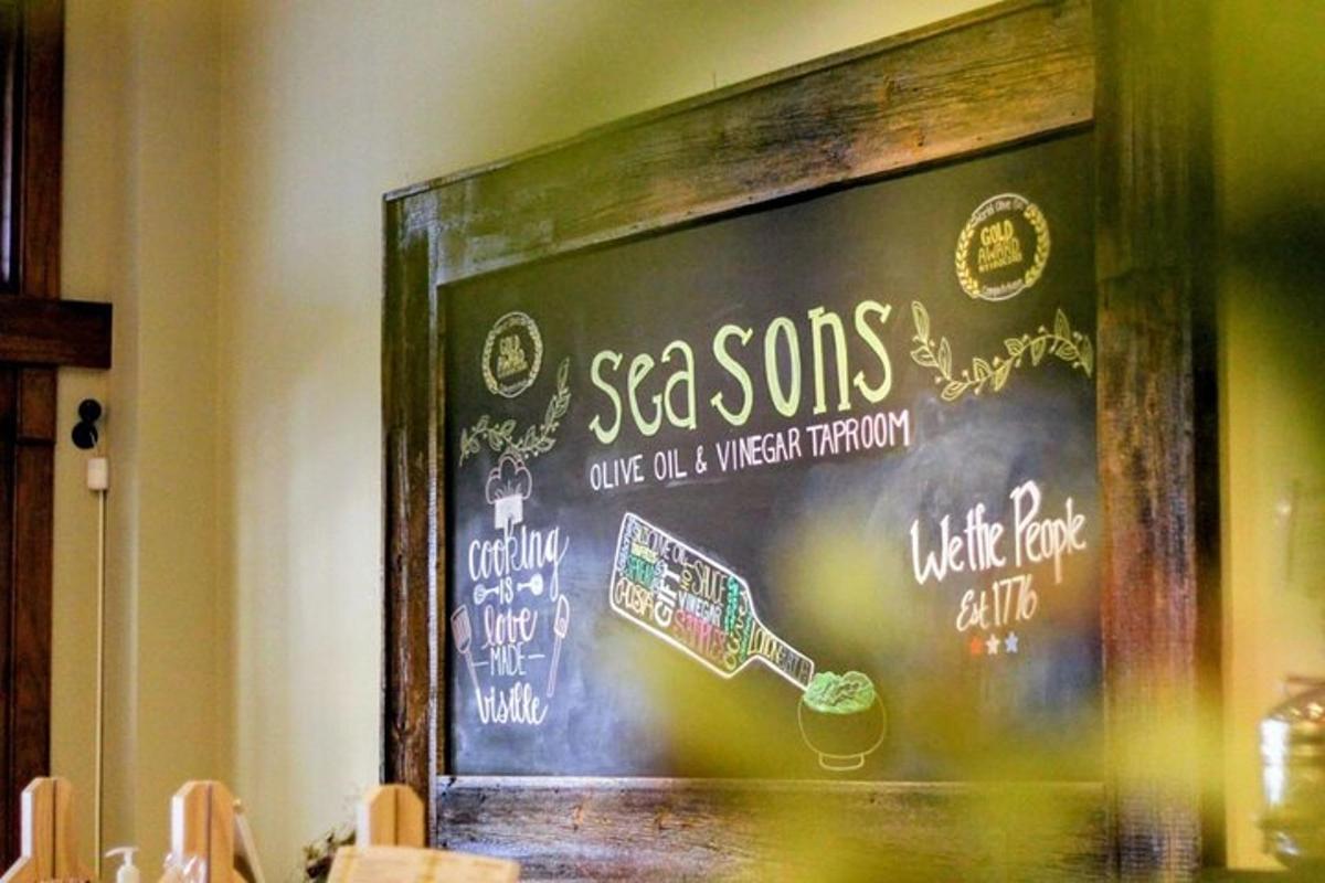 a chalkboard with a sign on a wall