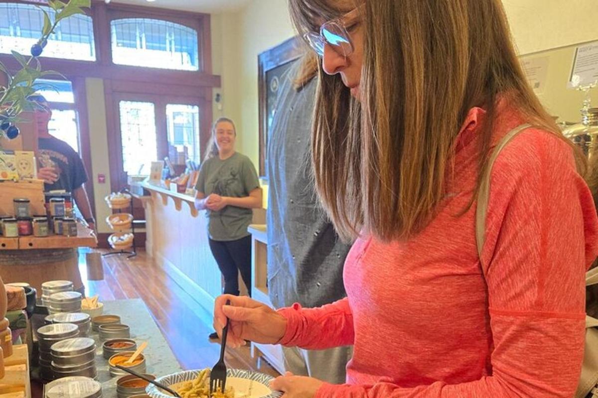 a woman preparing food on a counter in a store