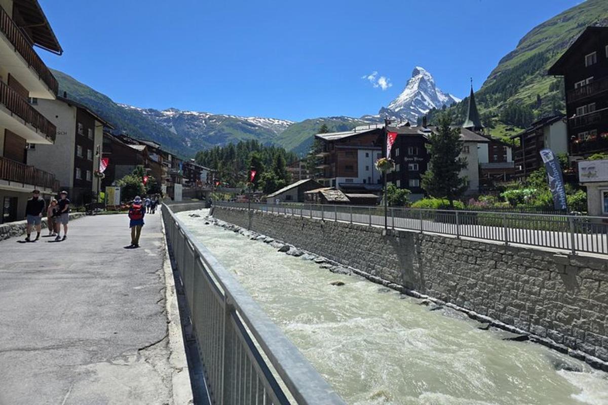 a street in a town with a mountain in the background