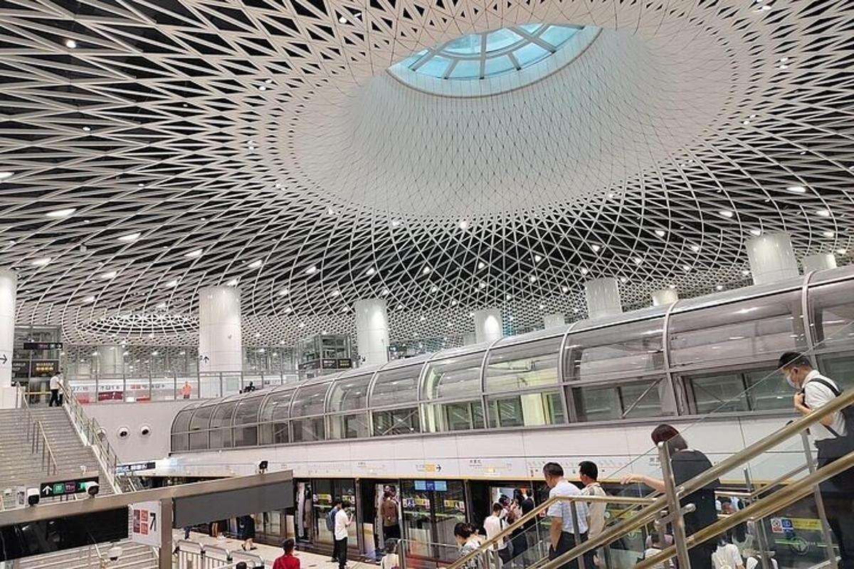 a large building with a domed ceiling and people walking around