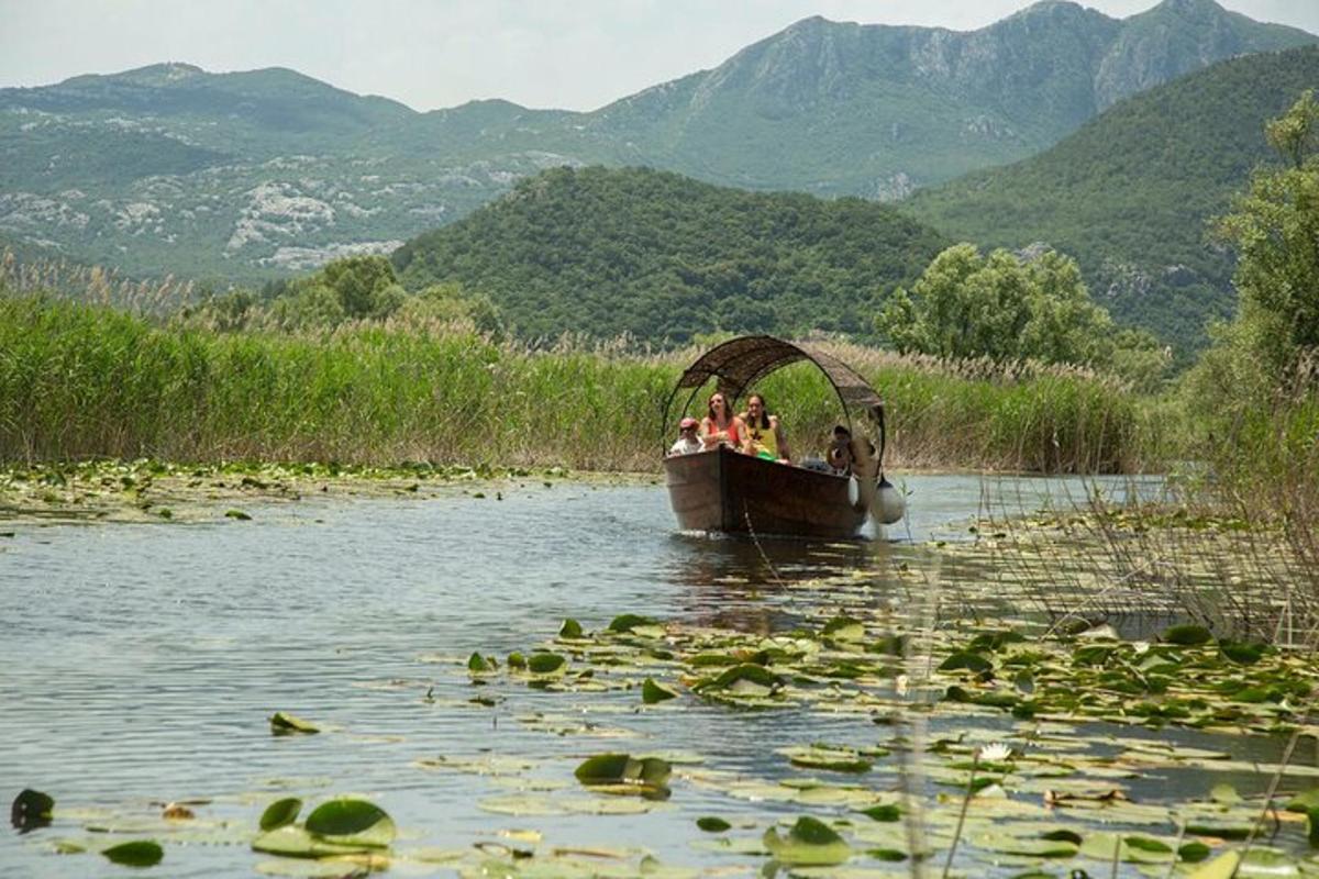 a group of people riding a boat in the water