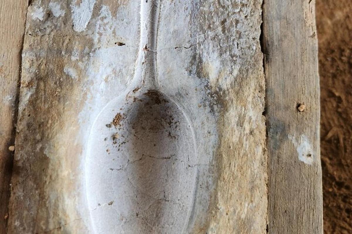 a dirty glass vase sitting on top of a table