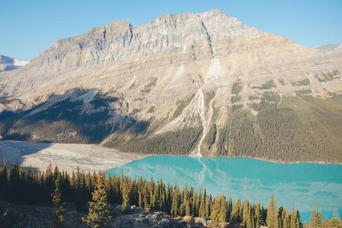 a mountain with a blue lake in front of it