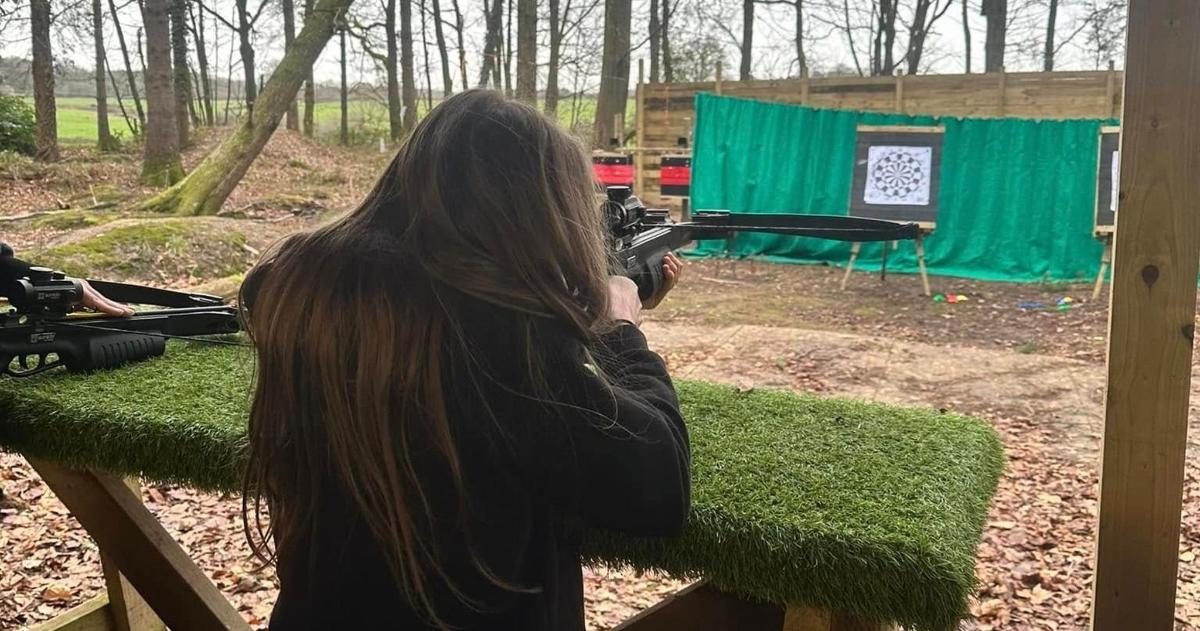 a woman is taking a picture with a camera