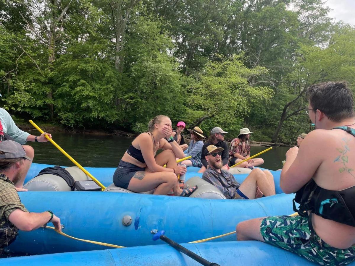 a group of people on a raft on a river