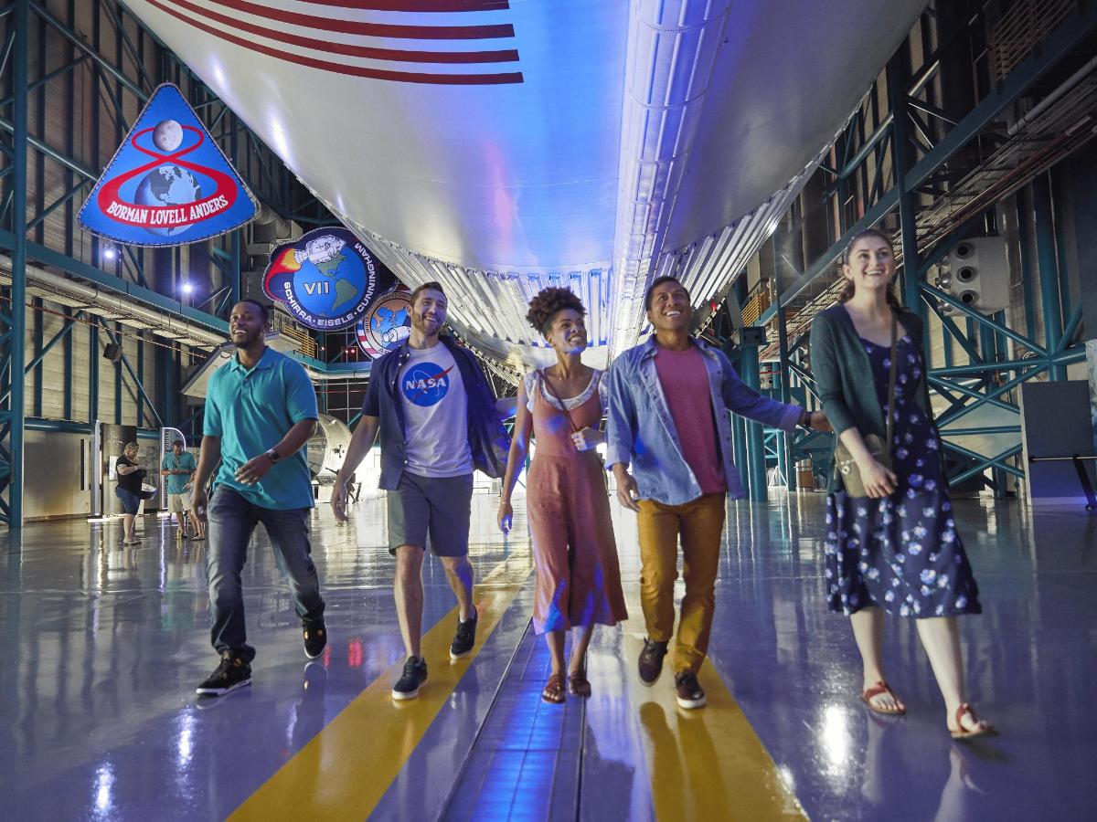 a group of people walking down a bowling alley