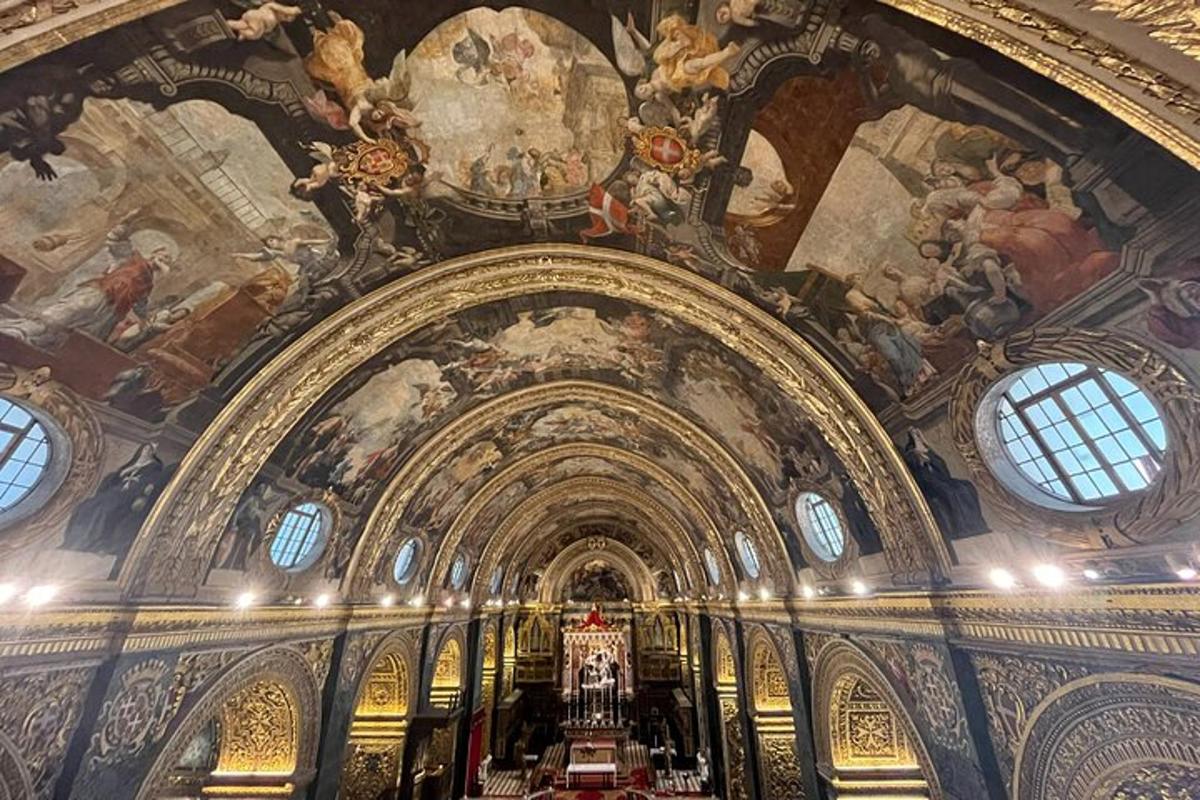 a large room with paintings on the ceilings of a building