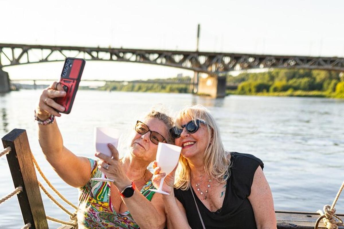 two women taking a picture on a boat on the water