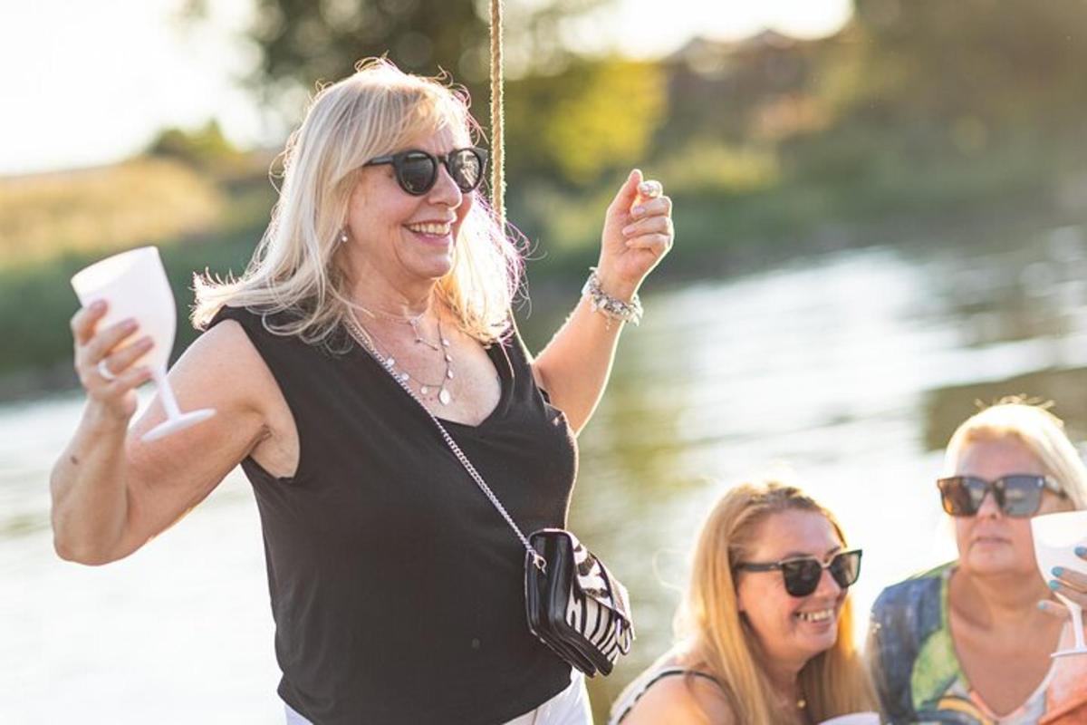 a woman holding up her hand while riding a swing