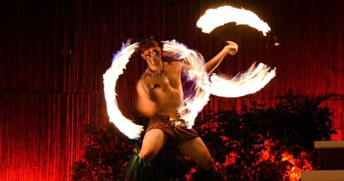 a woman with white wings dancing on a stage