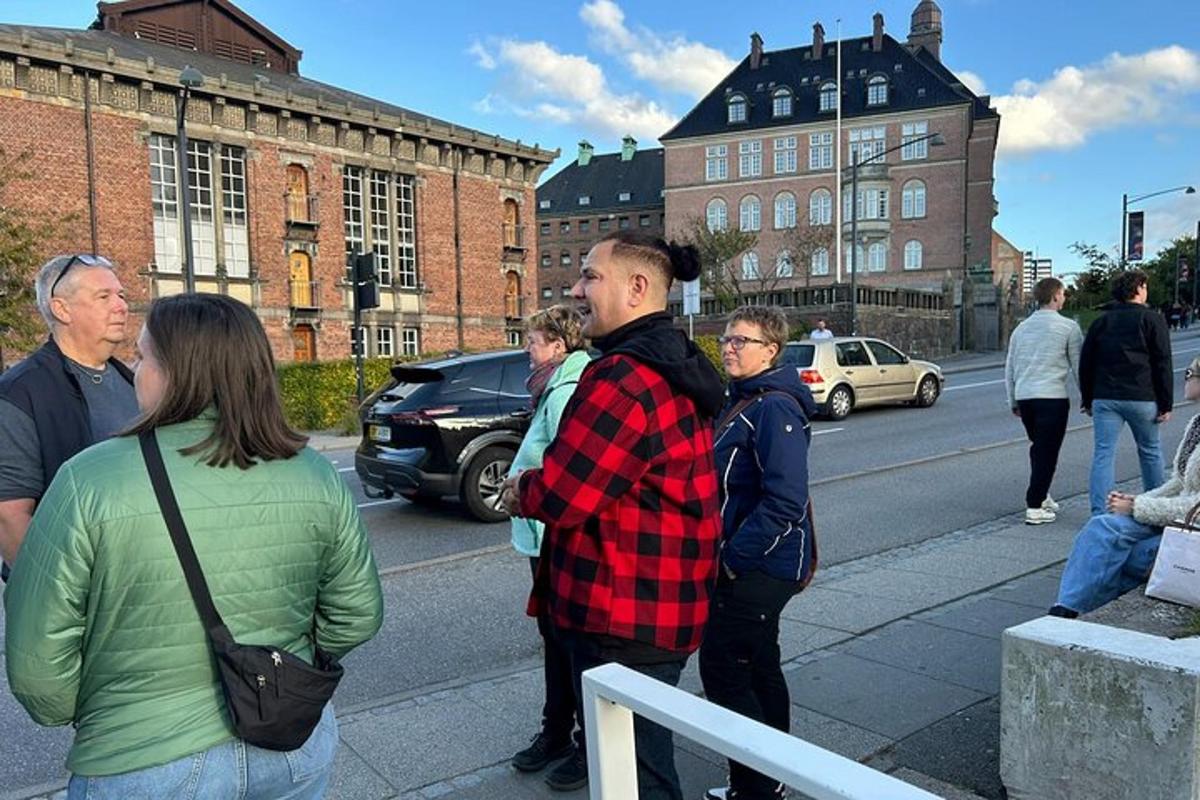 a group of people standing on the side of a street