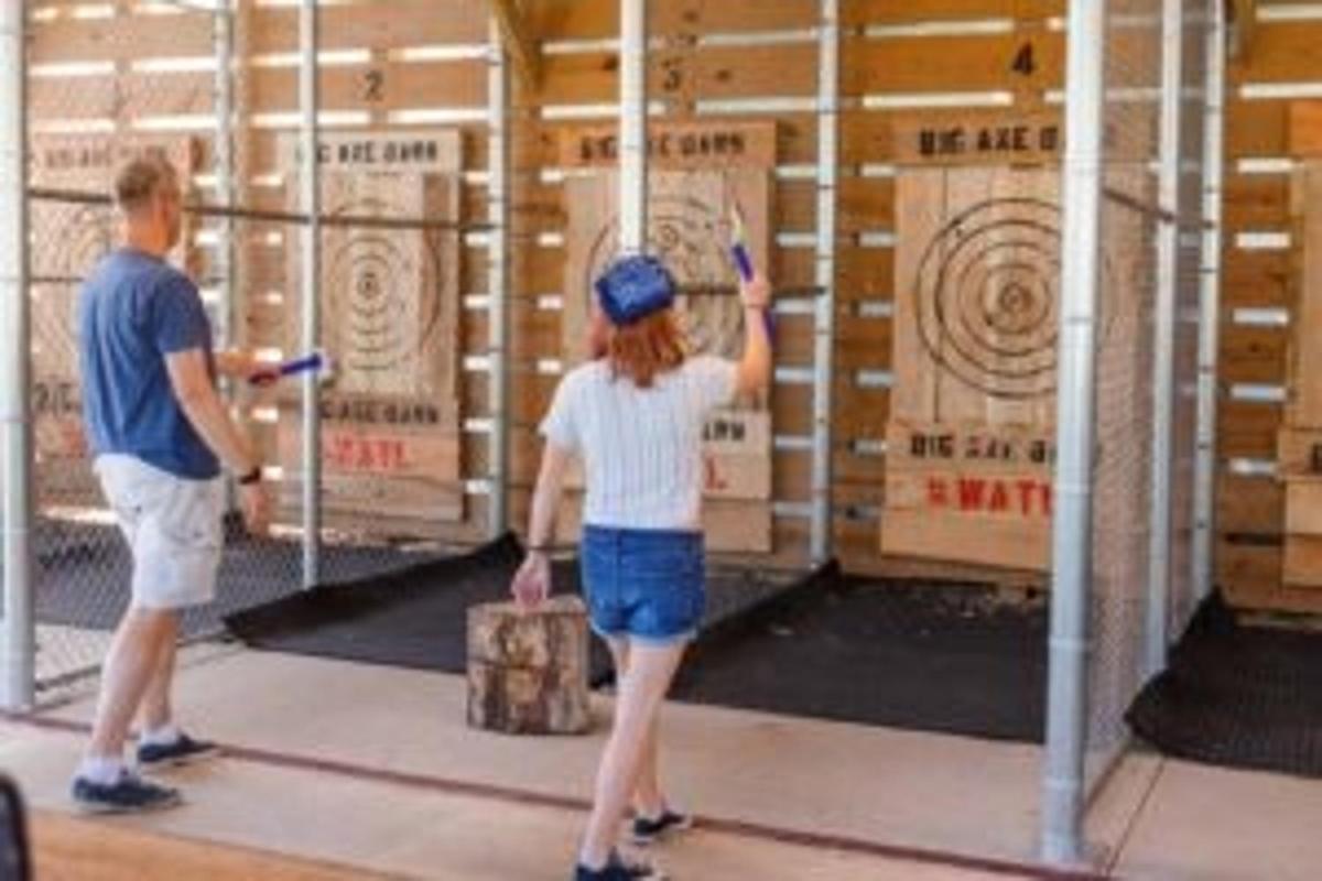 a man and a woman standing in front of boxes