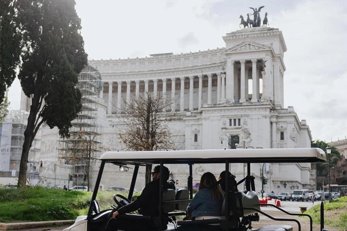 a group of people riding in a golf cart in front of a building