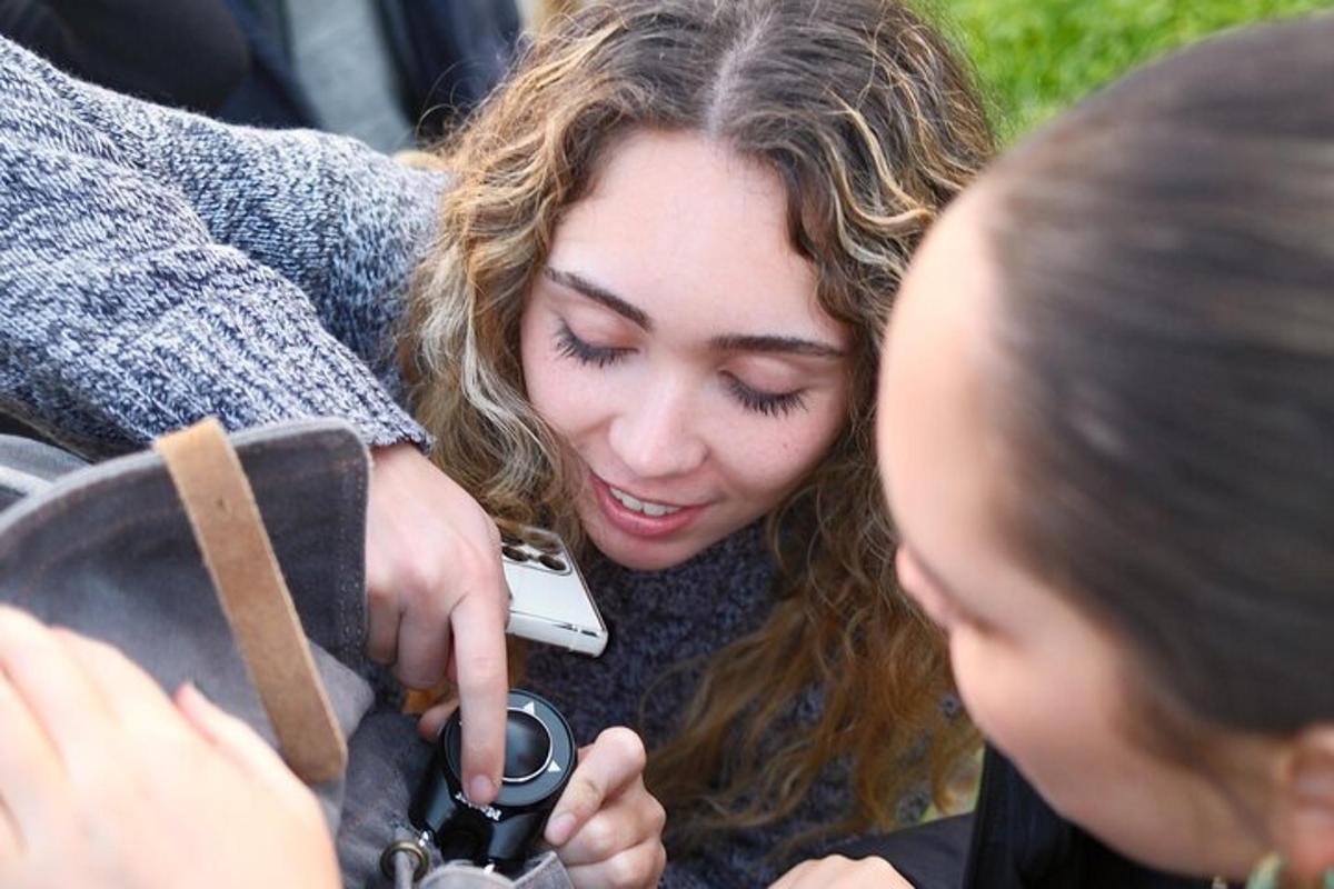 a woman taking a picture of another woman with a camera