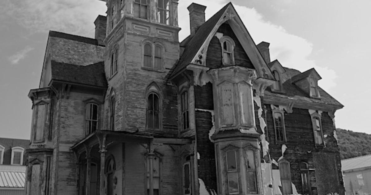 an old building with a tower on top of it
