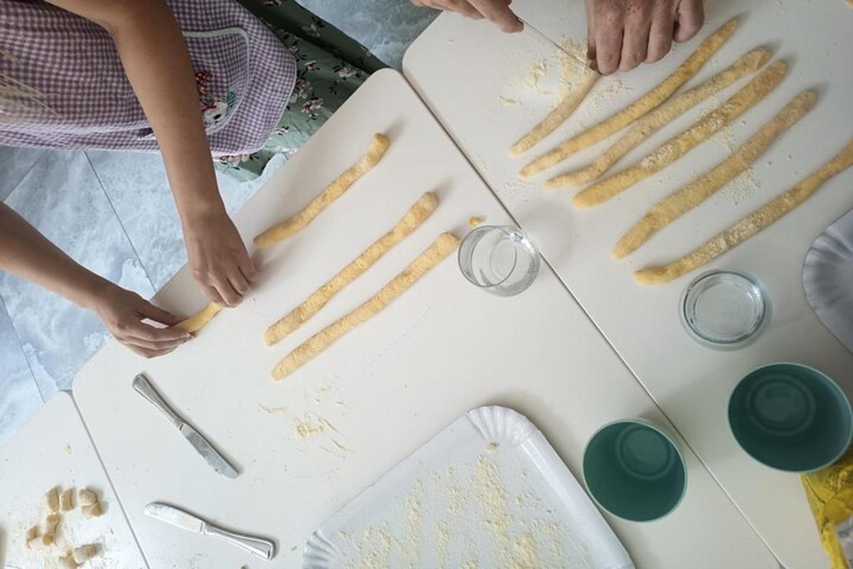 a group of people preparing food on a table