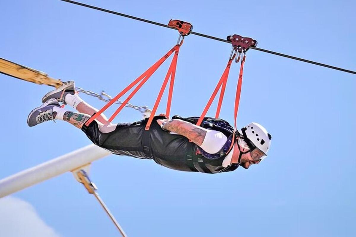 a person on skis on a zip line