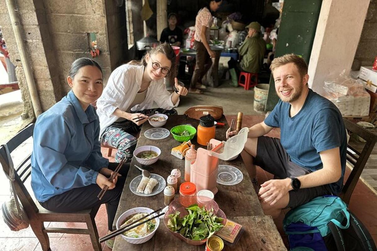 a group of people sitting around a table eating food