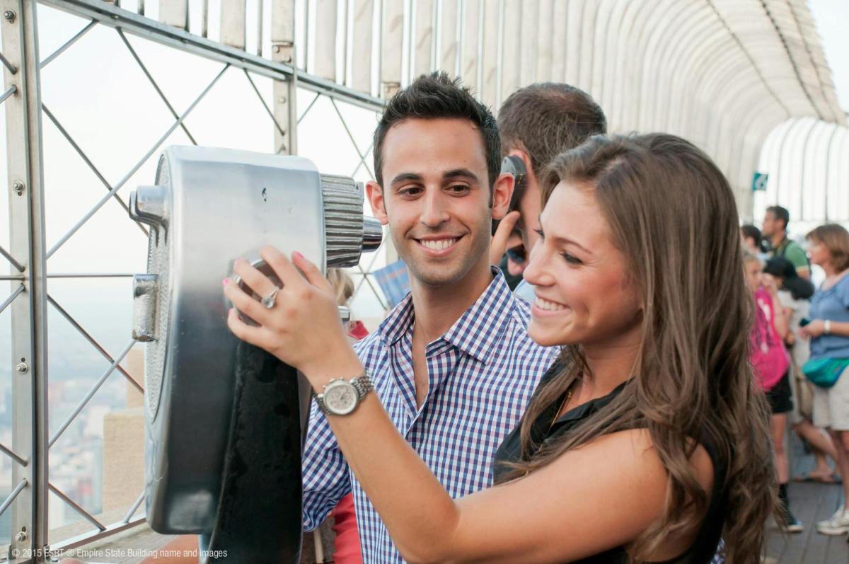 a woman is taking a picture of a man