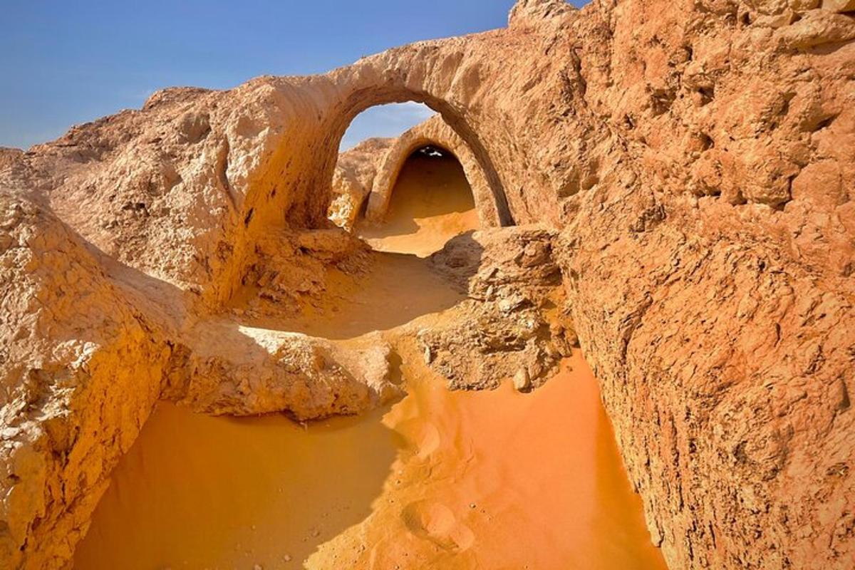 an archway in the side of a rock formation