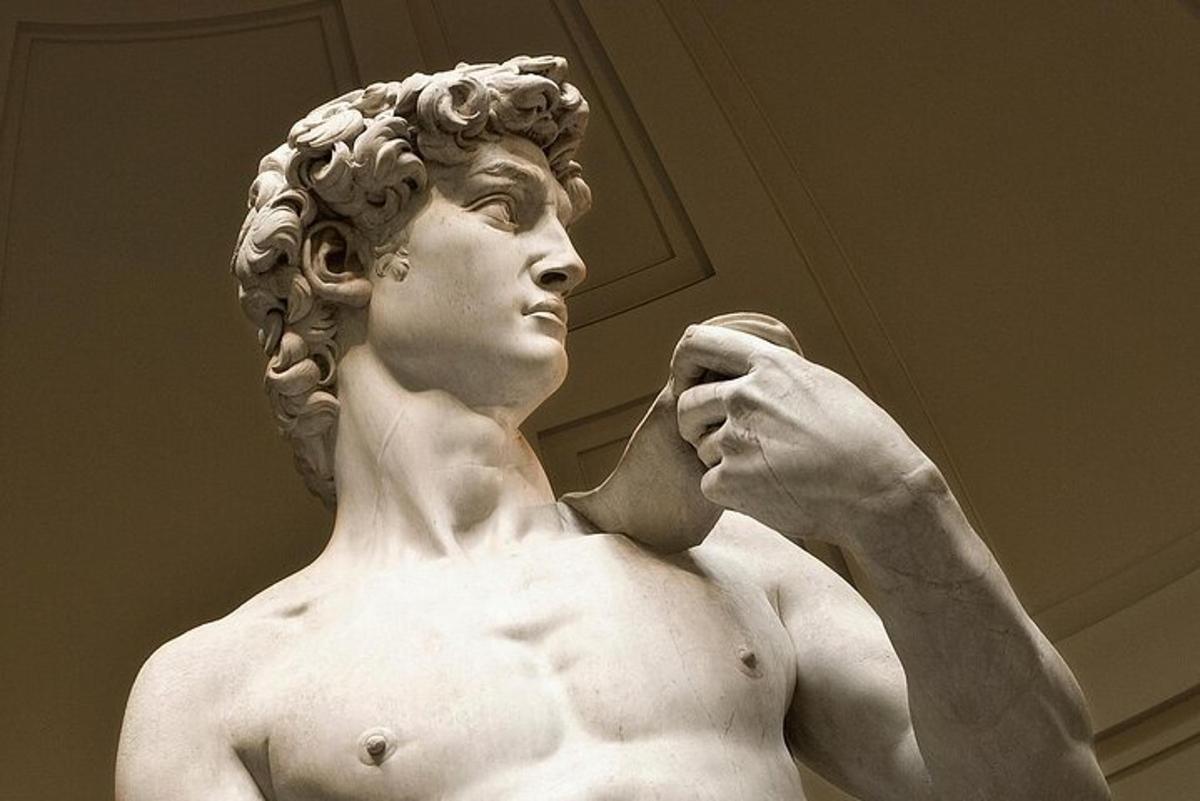 a statue of a man brushing his teeth