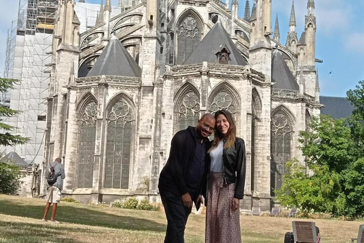 a man and woman standing in front of a church