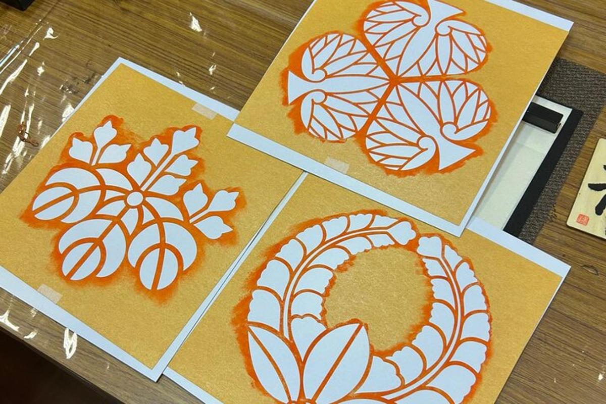four pictures of drawings of leaves on paper