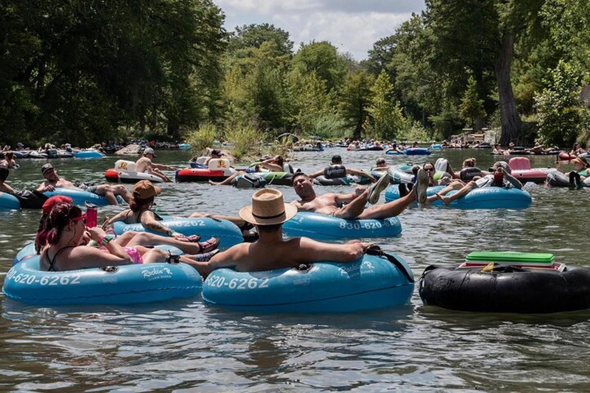 a group of people floating on tubes in the water