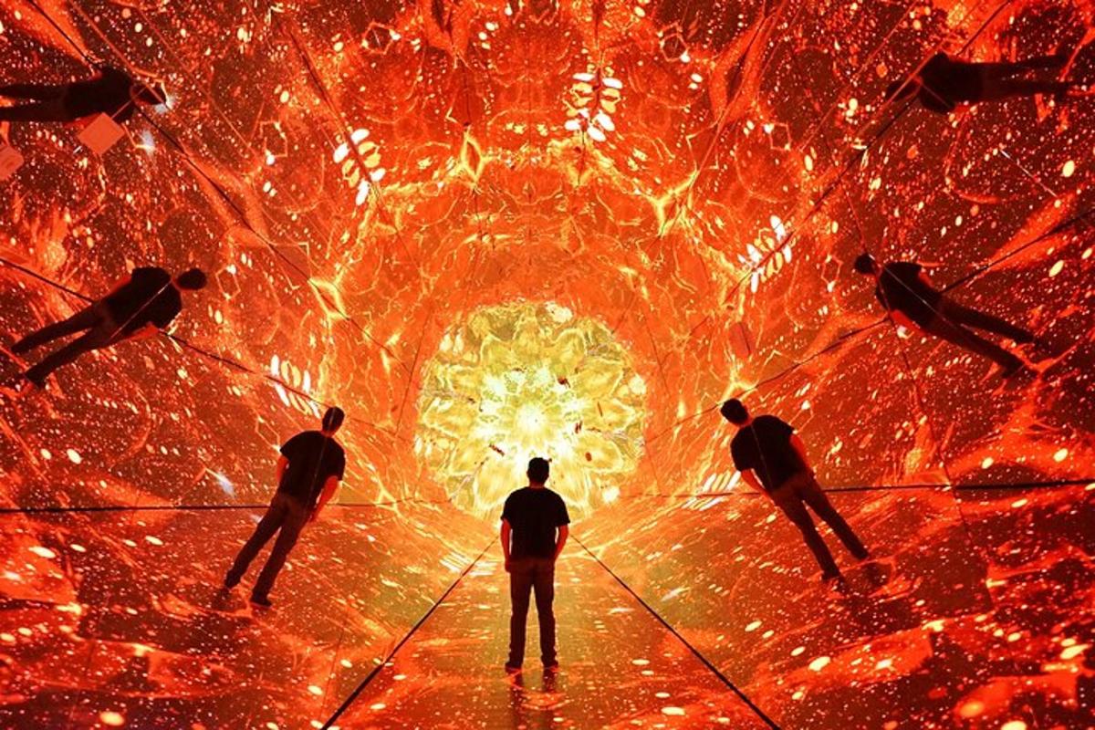 a group of people standing in front of a tunnel
