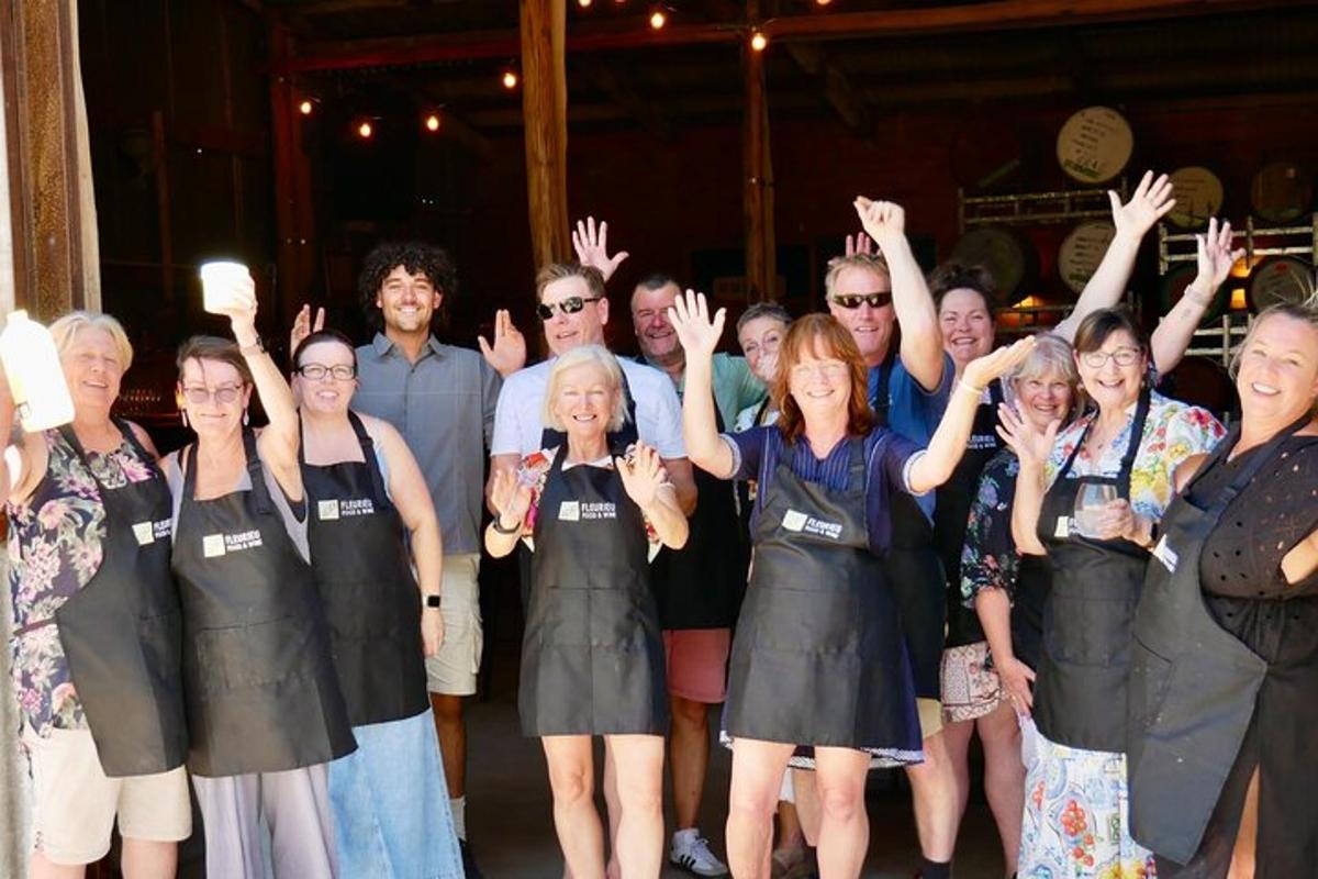 a group of people posing for a picture with their hands up